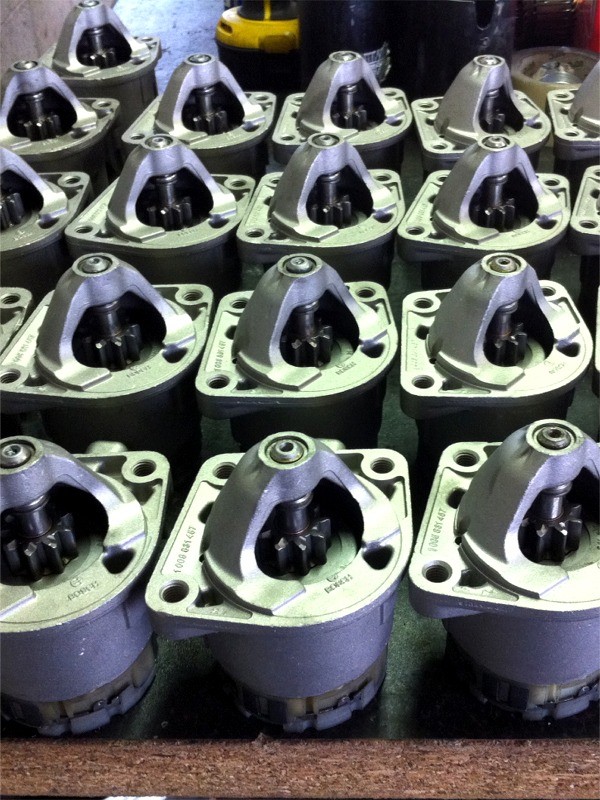 Parts of remanufactured starter motors ready for reassembly